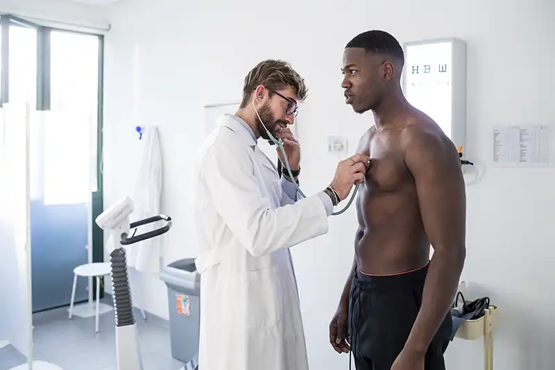 doctor examining patient in specialized care consultation room