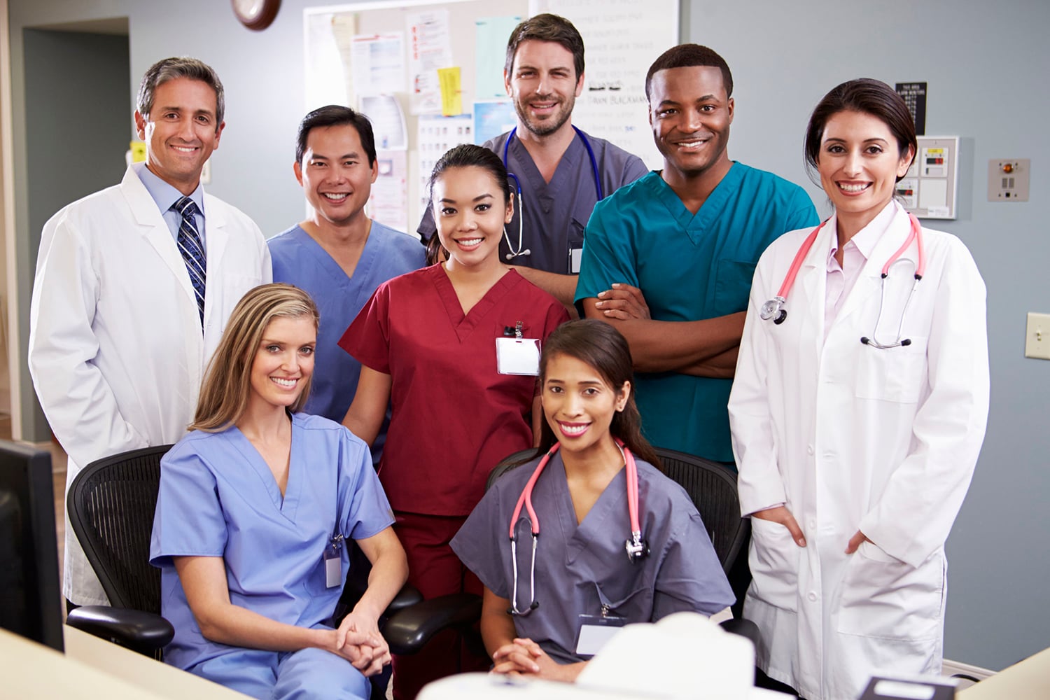 Portrait Of Medical Team At Nurses Station
